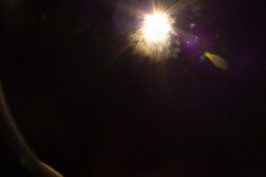 Sun flare on the black background