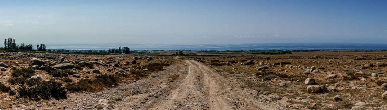 Rough dirt road through rocky terrain and mountains Kyrgyzstan