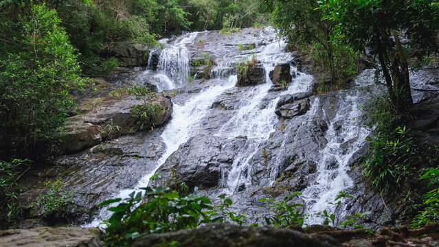 Landscape of the river flowing through the waterfall in the forest