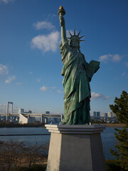 The Odaiba replica Statue of Liberty with the Rainbow Bridge behind, Japan © viabadalona