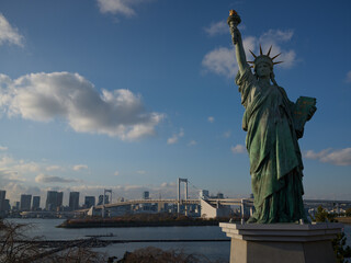 The Odaiba replica Statue of Liberty with the Rainbow Bridge behind, Japan © viabadalona