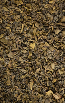 Green tea leaves macro textured background