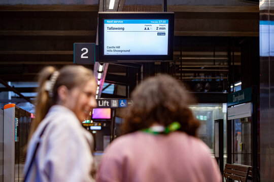 Digital display overhead indicates the next service to Tallawong, departing in two minutes