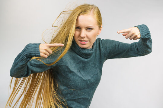 Angry female pointing with fingers