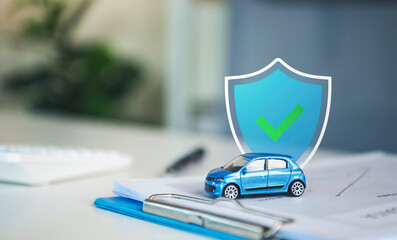 Car insurance protection with miniature vehicle and shield on policy documents representing auto coverage accident risk management financial security claims and reliable insurance service. © Custard Pixel