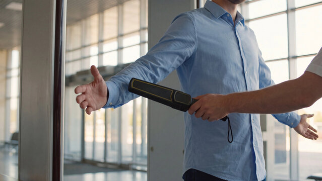 Metal detector screening at the airport. Security and counter-terrorism concept.