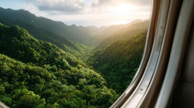 An aerial perspective captures the breathtaking beauty of a lush green mountain valley at sunrise, highlighting the vibrant landscape and serene atmosphere it creates.