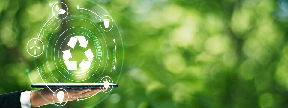 Sustainable recycling technology concept with laptop, clean green nature background, circular economy, eco innovation and environmental responsibility.
