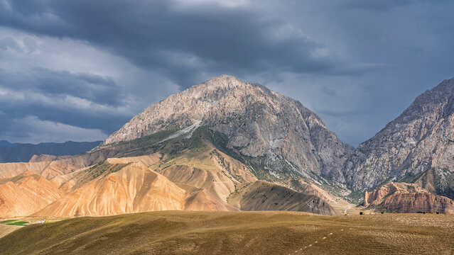 Scenic mountain landscape view in Gulcha valley on overcast summer afternoon, Osh, Kyrgyzstan