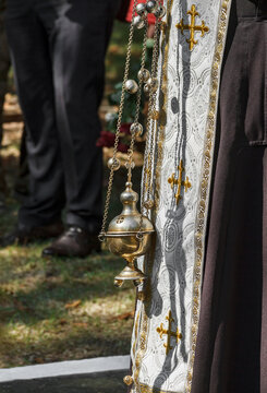 Orthodox Priest Holding Golden Censer