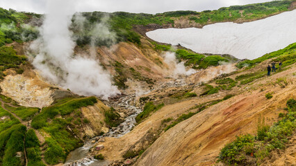 Steam from the fumaroles of Dachnye Hot Springs in Kamchatka, drifting across a rugged volcanic valley beneath Mutnovsky Volcano.  © Artaxerxes