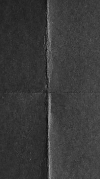 Distressed black paper texture with fold lines and grunge details