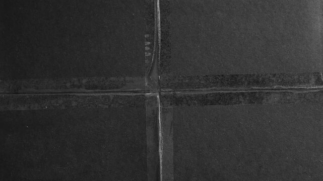 Dark textured concrete surface with geometric grid pattern background