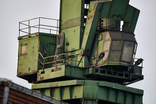 Close-up of an old green industrial crane operator cabin at the historic shipyard in Gdansk, Poland