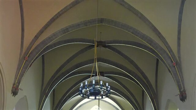 Rear interior view of Eglise Saint Maurice with wooden pipe organ in Annecy France