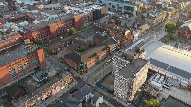Aerial video of Sunrise Over Union Street and Town Centre and a Tram travelling towards Rochdale. 