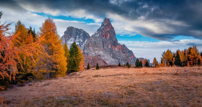 Gloomy autumn view of Cimon della Pala peak. Stunning evening view of Dolomite Alps. Wonderful outdoor scene of Italy, Europe. Traveling concept background.