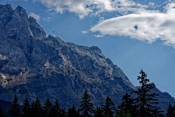 Obraz premium Cable Car Tower and Majestic Face of Mount Zugspitze in Bavaria Germany