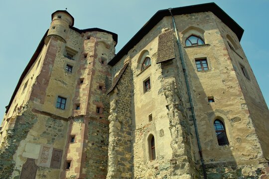 Detailed close-ups of the historic Star&yacute; Z&aacute;mok (Old Castle) in Bansk&aacute; &Scaron;tiavnica, Slovakia, featuring ancient stone reliefs, a round tower, and external wooden galleries.