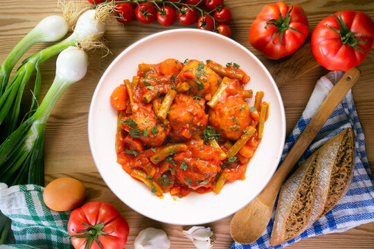 Meatballs with tomato and vegetable sauce. Overhead view of the table. 