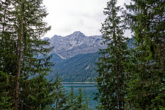 Turquoise Waters and Islands of Lake Eibsee Beneath Zugspitze Mountain Peak