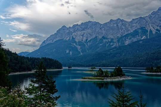 Turquoise Waters and Islands of Lake Eibsee Beneath Zugspitze Mountain Peak