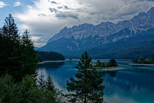 Turquoise Waters and Islands of Lake Eibsee Beneath Zugspitze Mountain Peak