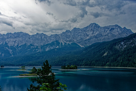 Turquoise Waters and Islands of Lake Eibsee Beneath Zugspitze Mountain Peak