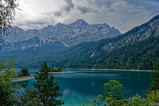 Turquoise Waters and Islands of Lake Eibsee Beneath Zugspitze Mountain Peak