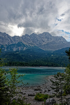 Turquoise Waters and Islands of Lake Eibsee Beneath Zugspitze Mountain Peak