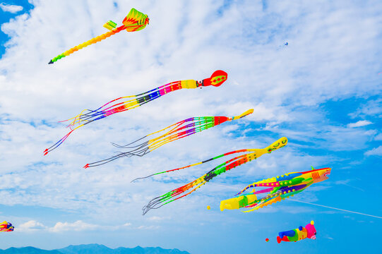 Flying colorful kites in the blue sky. Kite Festival