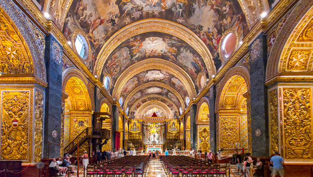 Interior of St. John's Co-Cathedral with golden baroque decorations in Valletta, Malta