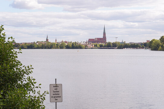 No anchoring and diving sign overlooking Ziegelsee and Schwerin skyline in Germany