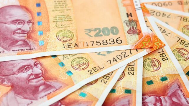 India money rotating, Lot of Indian rupees. Indian currency, Financial concept, 200 INR banknotes. close up