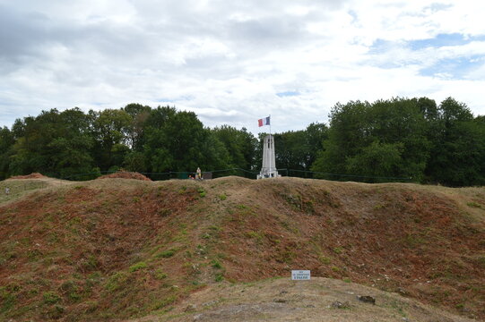 Vauquois summit memorial framed by trees and crater rims