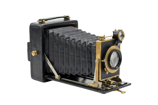Antique folding camera with black bellows and brass lens details isolated on a transparent background