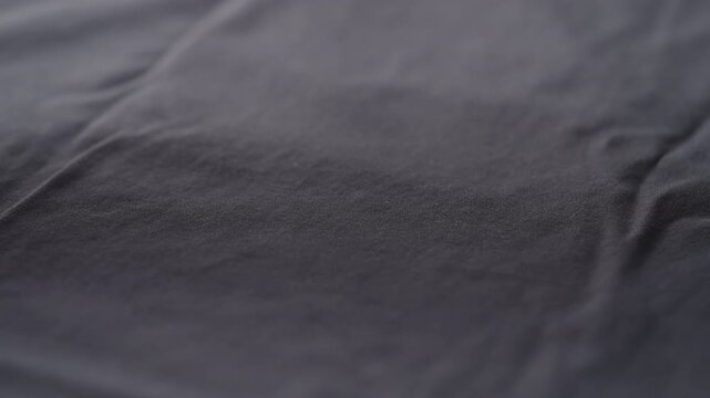Slow motion man hand clean blue cotton jersey cloth