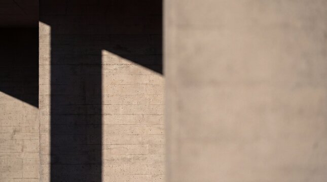 Sunlight and Geometric Shadows on Concrete Architectural Wall