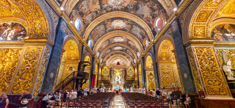 Interior of St. John's Co-Cathedral with golden baroque decorations in Valletta, Malta