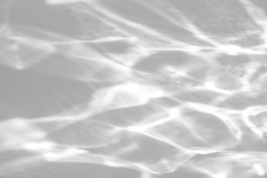 Real interlocking water caustic shadow cut out on a transparent png background with soft diffused edges. Lives in abstract beauty campaign and wellness social media design as a png overlay.