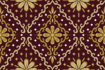 Ethnic ikat seamless pattern in burgundy and gold. Ornamental floral mandala background for luxury fashion textile print, home decor fabric, and wallpaper. © Umpa 