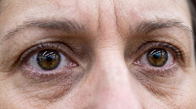 Person's eyes reveal intense focus and determination, reflecting a sense of vigilance and responsibility, suitable for concepts of elections, oversight, or careful observation