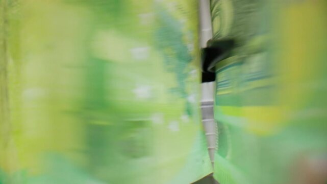Extreme macro shot of 100 Euro banknotes in a rapid cash counting machine
