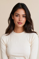 Fototapeta premium young latina woman with confident expression, latina woman portrait with soft wavy hair, elegant latina female studio portrait