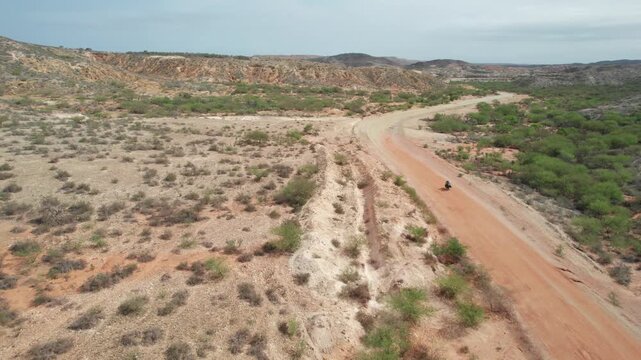 Aerial view of a motorcycle on a dirt road in Araya, Venezuela.