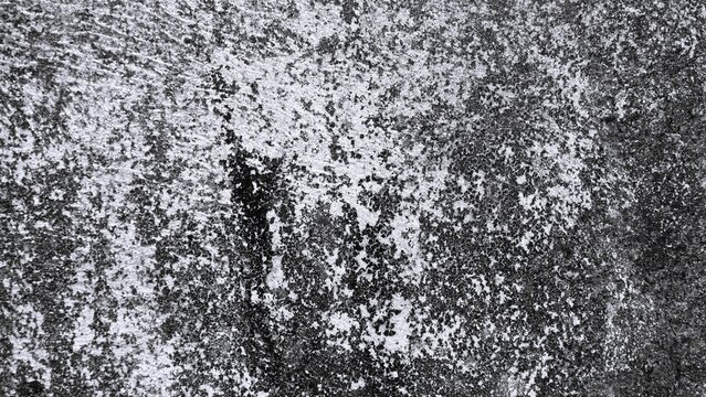 Rough stone texture in high contrast black and white with dense granular details and irregular surface formations, ideal for grunge, industrial, and abstract backgrounds.