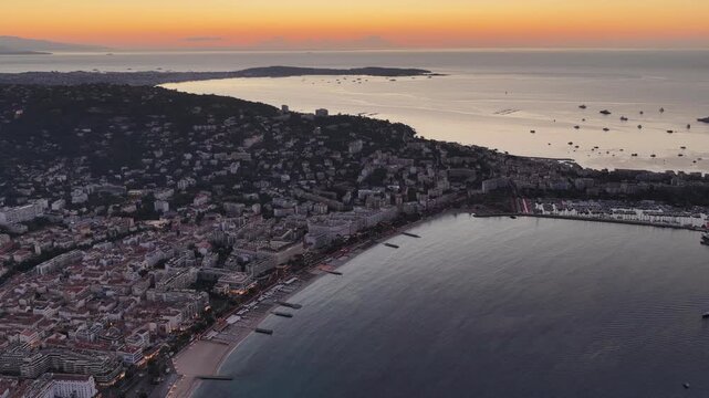 Aerial view of Cannes coastline at sunset in France.