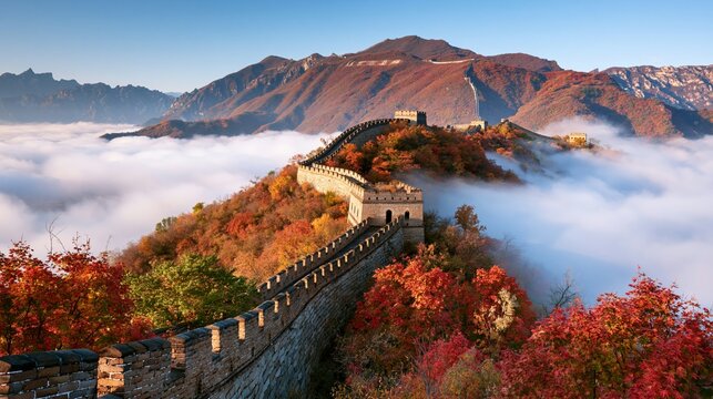 a vivid portrayal of the Great Wall of China during autumn. The ancient stone wall is the main subject, winding its way through a dense forest of vibrant red, orange, and green trees.