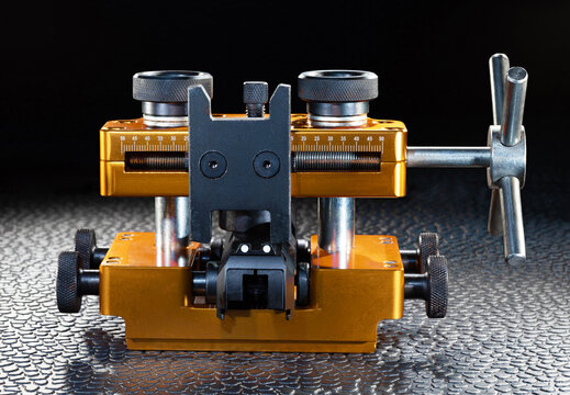Gunsmithing vise pushing rear sights on a pistol slide