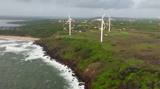 Aerial view of wind turbines at Devgad Beach, India.
